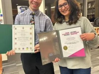 Vito Iafrate appears here with his co-worker Safeena Habeeb who nominated him for the honour. They are both holding one of the certificates he was awarded.