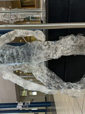 a statue of a human silhouette made of clear material. 